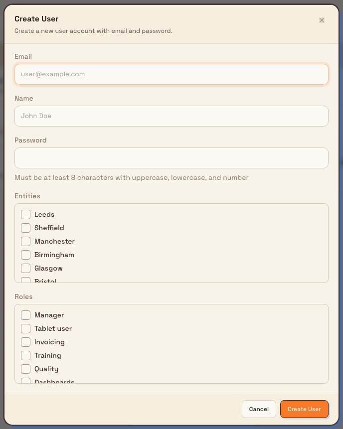 The Create User dialog with fields for email, name, and password, and checkbox lists for entities and extra roles.