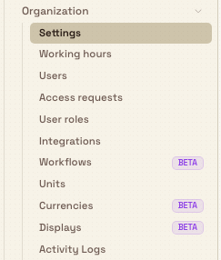 Settings sidebar showing the Organization group expanded with its pages, including Beta badges on Workflows, Currencies, and Displays.