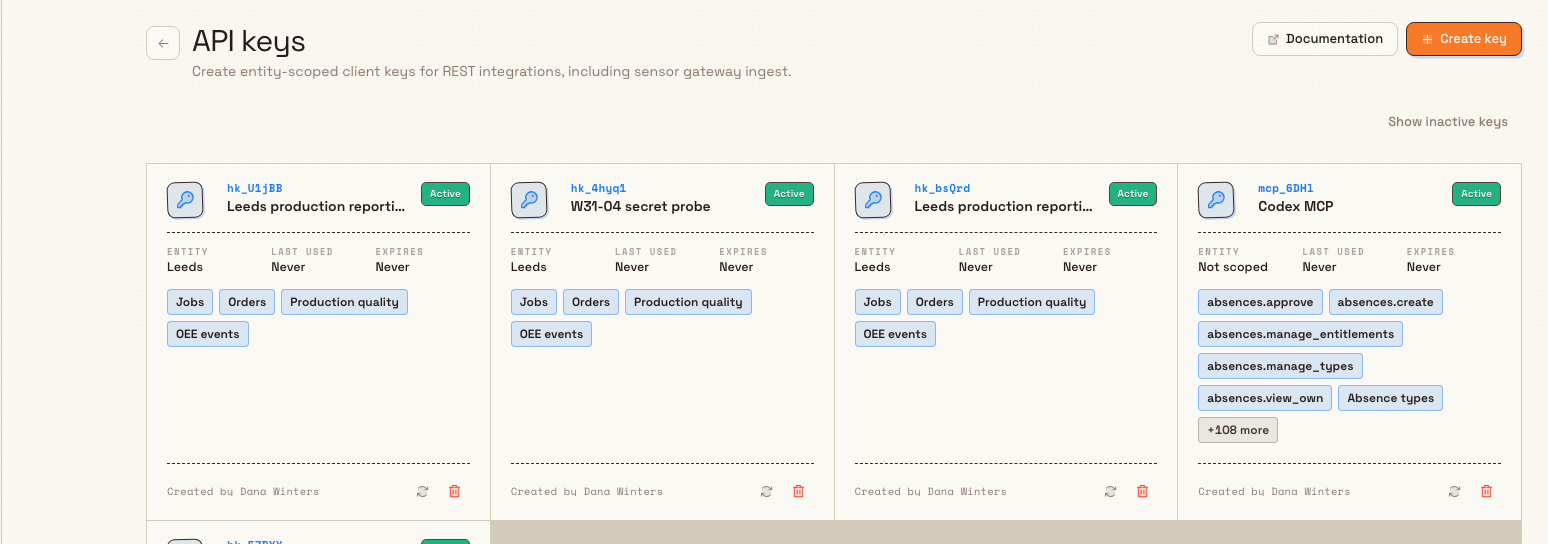 The API keys settings page listing entity-scoped client keys with status badges and permission chips.