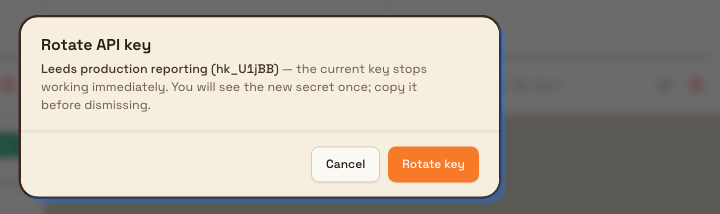Rotate API key confirmation dialog naming the key and warning the old secret stops immediately.