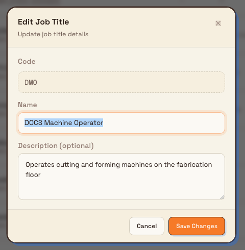The Edit Job Title dialog showing a greyed-out read-only code field above editable name and description fields.