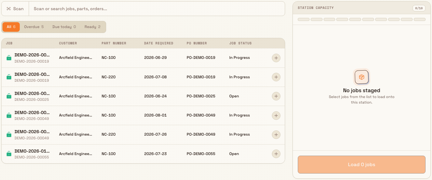 Load a job screen showing a searchable job results table on the left and an empty Station capacity panel on the right.