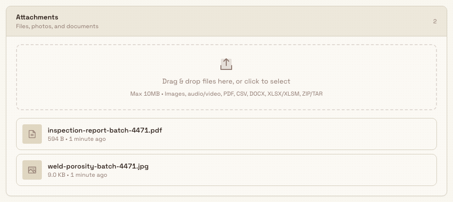 Attachments card on a task Details tab with an upload area and two listed files