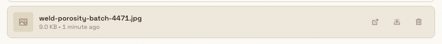 A hovered attachment row showing open, download, and delete action buttons