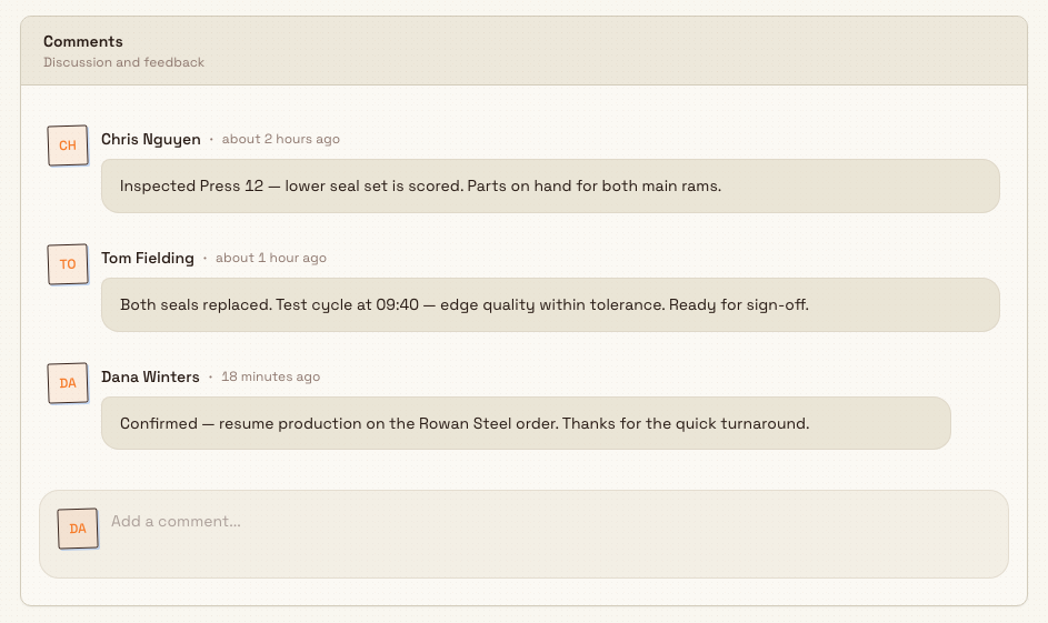 The Comments card on a task's Details tab showing a thread of comments above an 'Add a comment' input box.