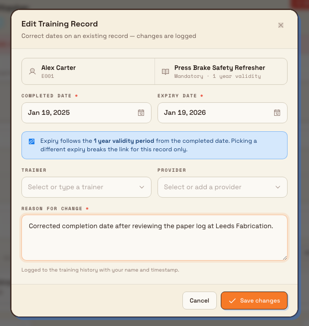 The Edit Training Record dialog showing editable completed and expiry dates, trainer and provider fields, and a required reason-for-change box.